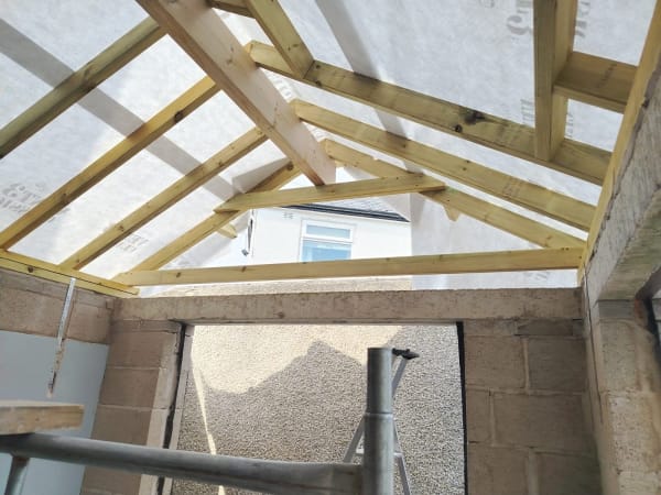 New roof rafters and breathable membrane in place before the covering is laid