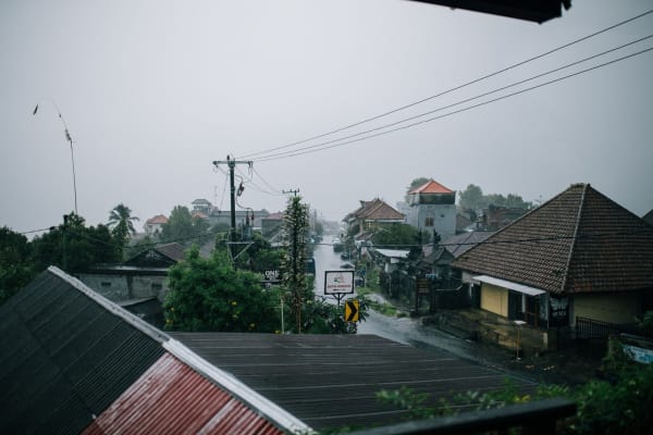 Storm clouds gathering over rooftops, the weather that causes storm damage to Carlisle roofs