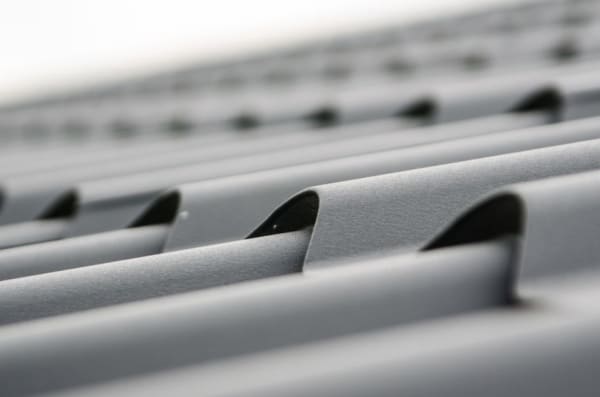 New concrete roof tiles laid on a replacement roof in Croydon