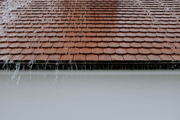 Rain running off a pitched roof, the conditions that reveal a roof leak in Southport