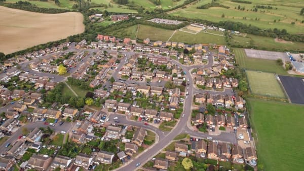 Aerial view of estate housing near Weston-super-Mare where flat-roofed garages and extensions are common