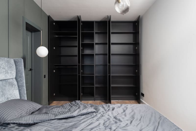 Contemporary built-in wardrobes with dark door panels