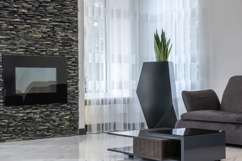 Media wall with inset electric fireplace in a modern living room