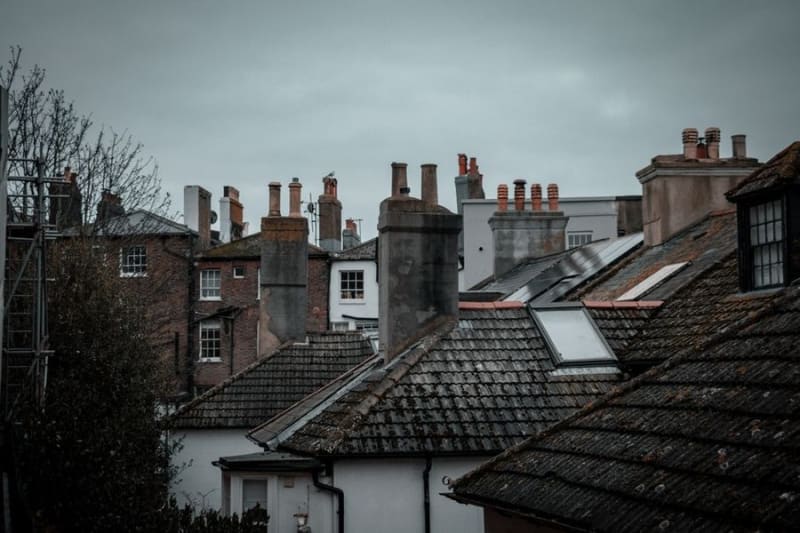 Croydon rooftops with Victorian chimney stacks against a grey sky