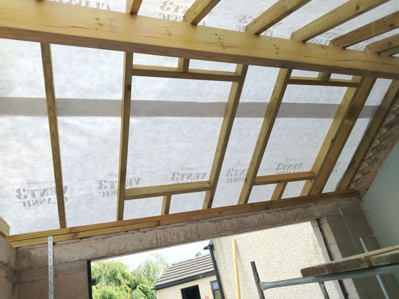Close view of roof rafters, battens and breathable membrane on a Southport roof before covering