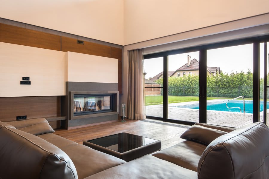 Aluminium sliding doors on rear extension of an Exeter property opening to garden
