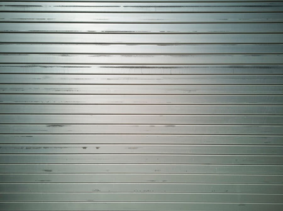 Close-up of slim aluminium sliding door frame profile showing narrow sightlines
