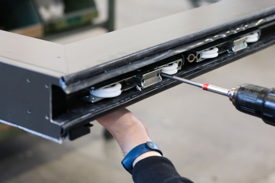 Aluminium sliding door track and roller hardware mechanism detail