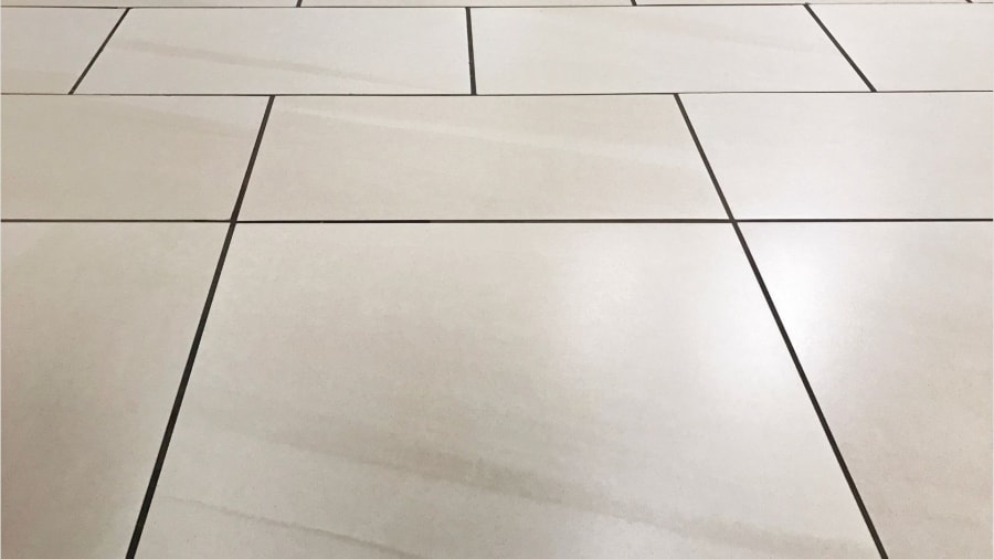 Tiled kitchen surface with neat grout lines between the tiles.