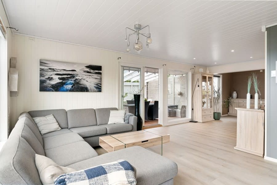 Bright interior living room flooded with light from bi-fold doors