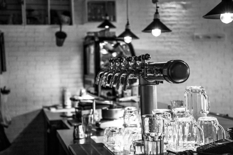 Busy bar servery with fridges, glasswashers and dispense needing power