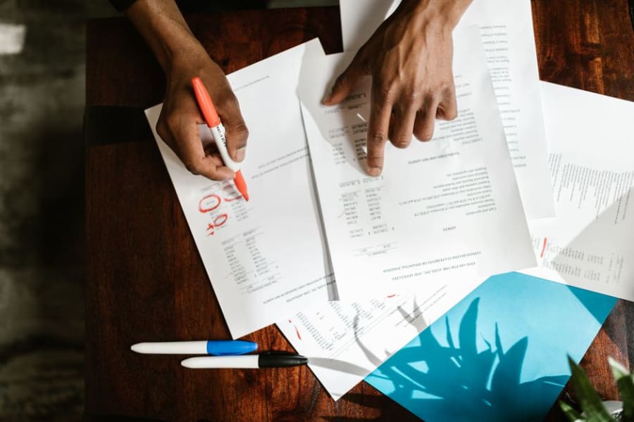 Business owner reviewing a commercial lease and electrical survey before signing
