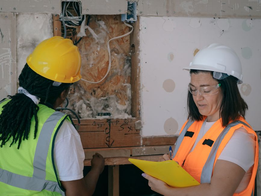 Electrician checking wiring and connections to catch faults before they cause problems