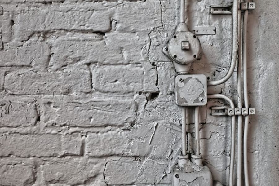 Electrician surveying a Bristol warehouse to price industrial electrical work