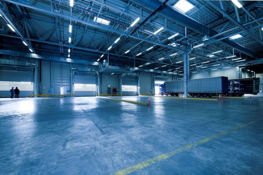 High-bay LED lighting installed across a large Bristol warehouse floor