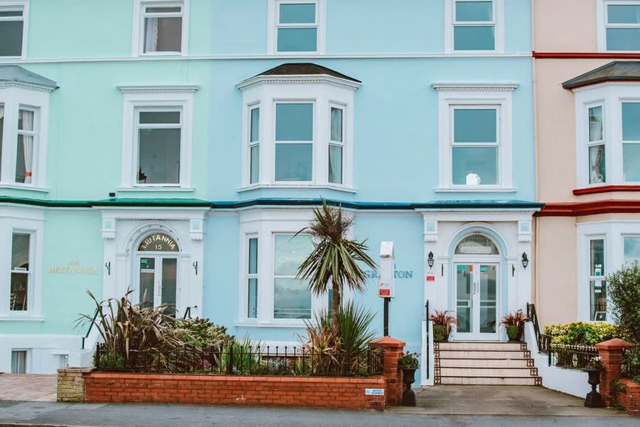 Row of colourful period Victorian terrace houses on Exeter residential street