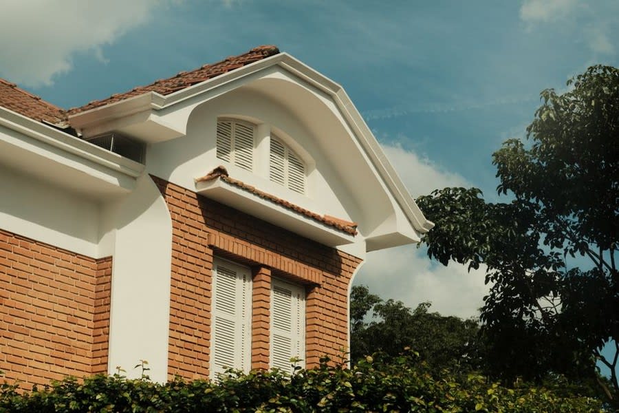 White uPVC casement window on brick residential property exterior