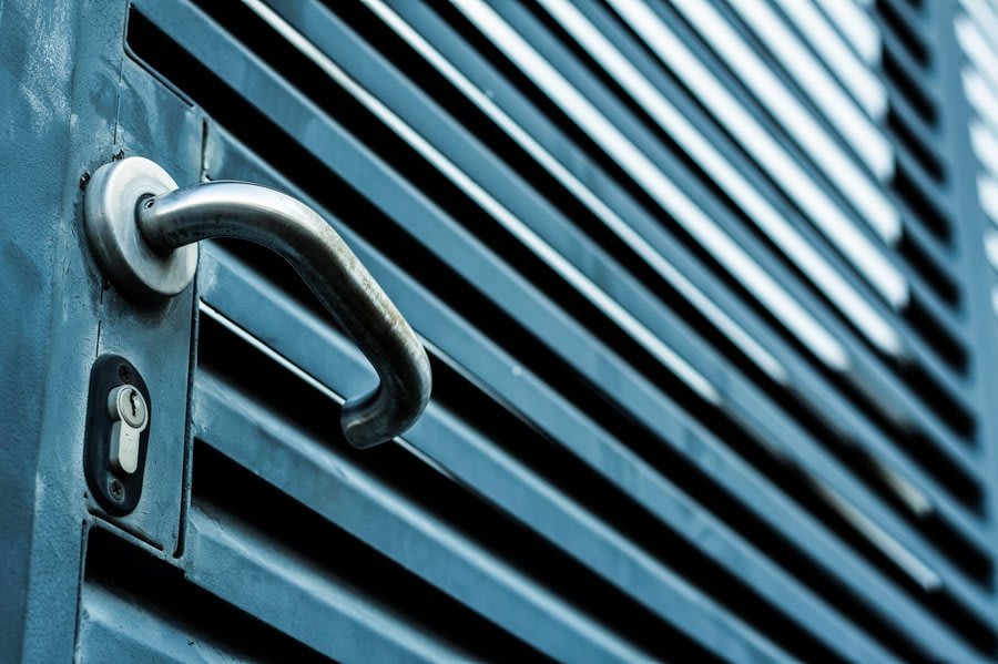 Close-up of composite door handle and multi-point lock mechanism