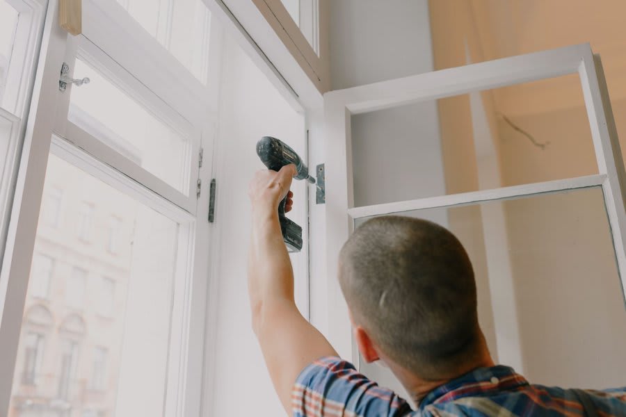 Window maintenance and repair work being carried out on Exeter property