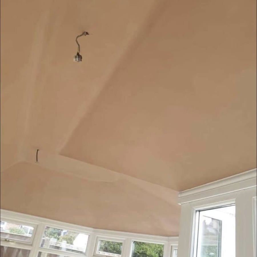 Newly plastered room with a fresh skim finish ready for decoration after a conversion in Cornwall