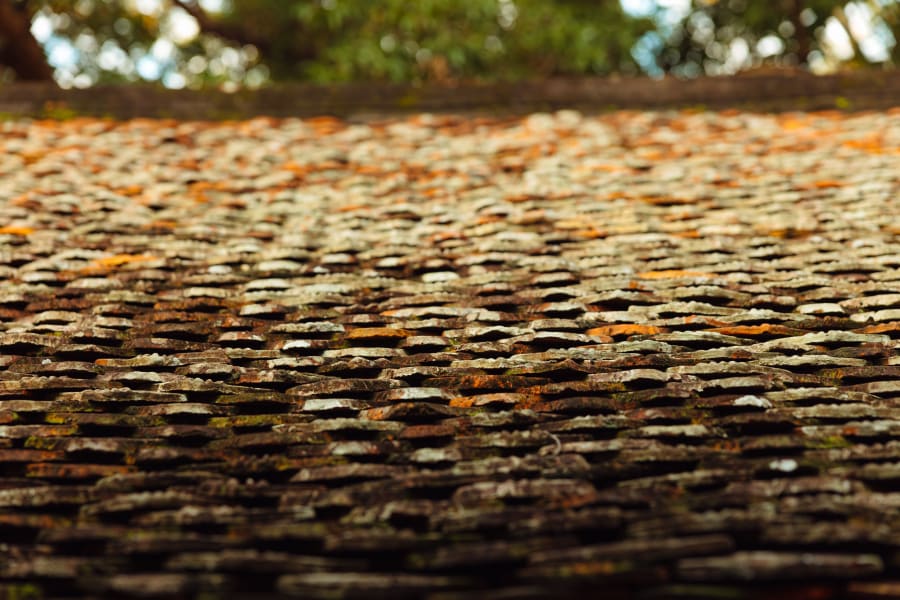 Close-up of a textured orange and brown woven surface with a blurred background