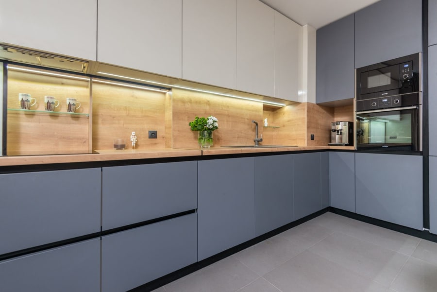 Kitchen fitter installing units in a Merseyside home