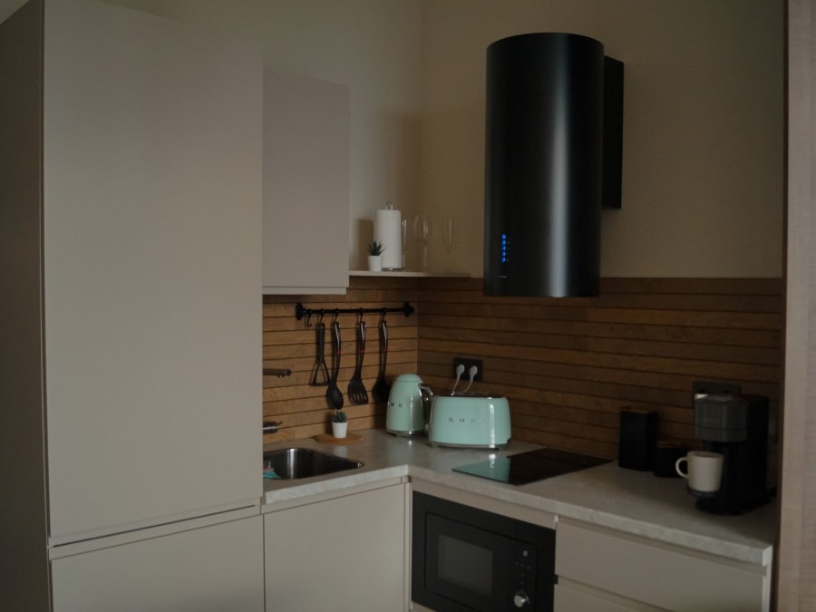 Kitchen fitter going through plans in a Merseyside home