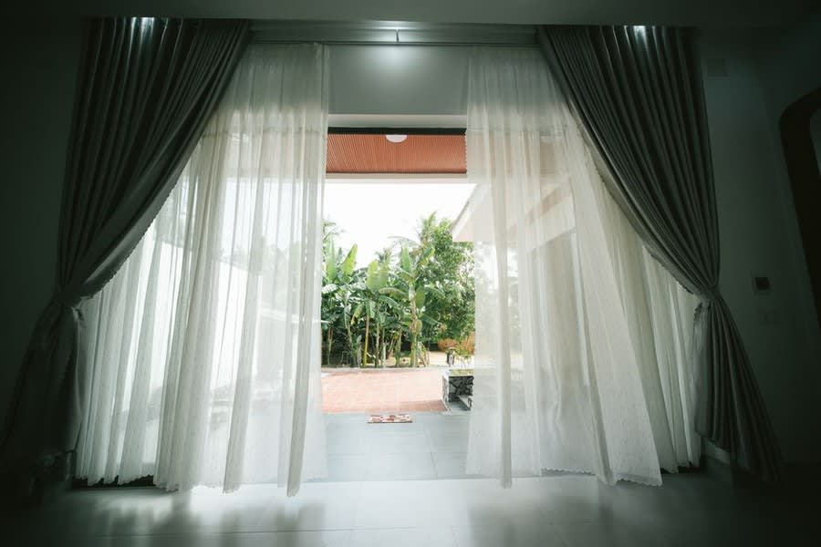 French doors opening onto a garden terrace from a residential property