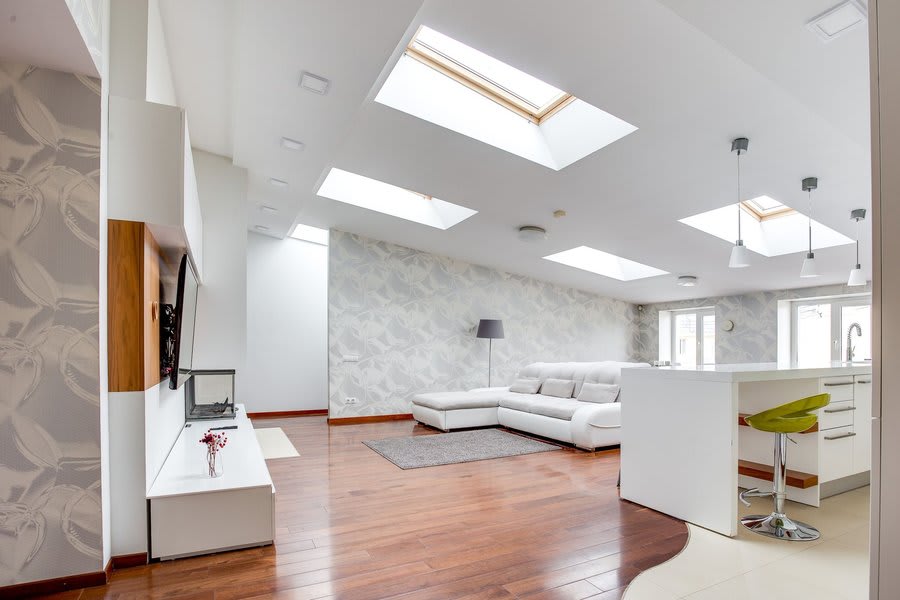 Flat roof skylight window bringing daylight into an Exeter room interior