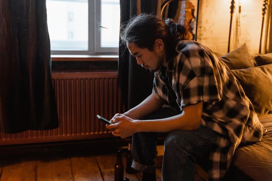 Someone checking reviews on a phone before booking a roofer