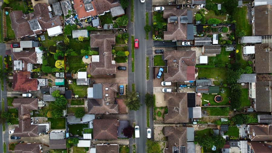 Aerial view over streets of coalfield-era housing with long terraced rows