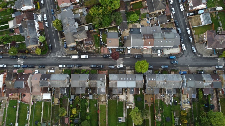 Aerial view of terraced streets whose roofs share the same age and materials