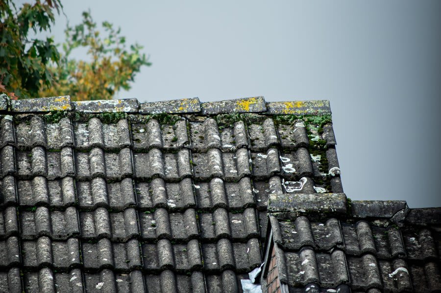 Aged and weathered pantile roof with moss growth on an older Mansfield building