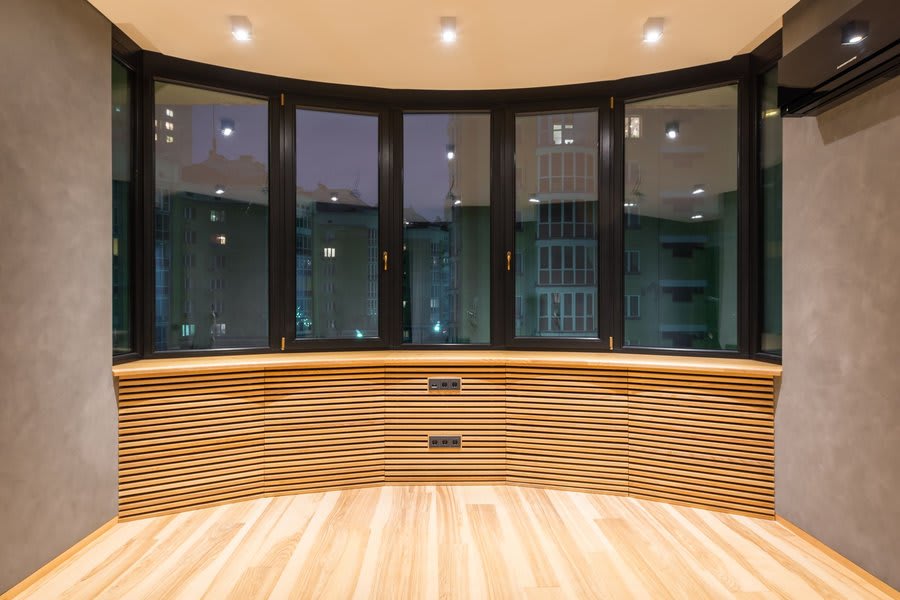 Tilt and turn window opened fully in turn position in modern interior room
