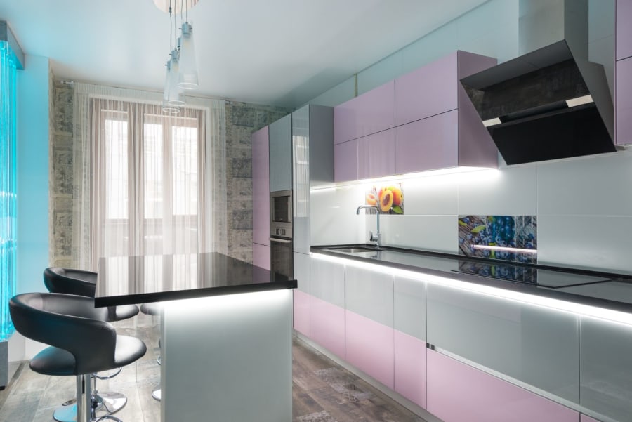 Kitchen fitter installing units on the Wirral