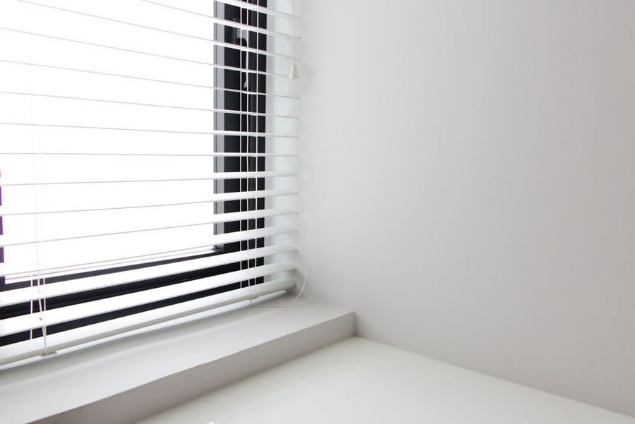 Clean interior finish around a newly installed white window frame