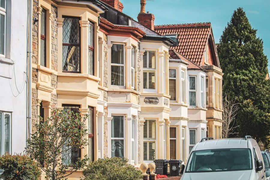 Row of Victorian terrace houses in Exeter showing original window styles