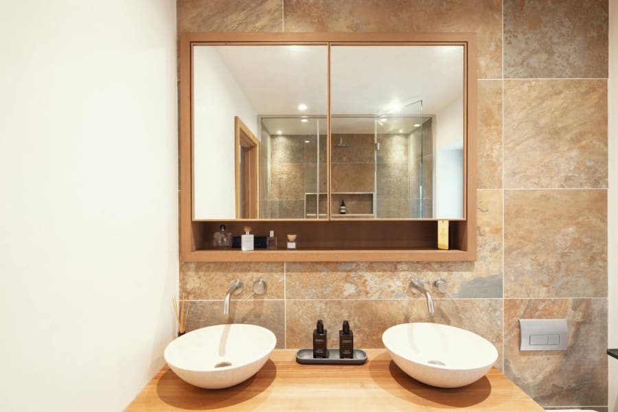 Bespoke oak vanity unit with twin basins, made to fit the room