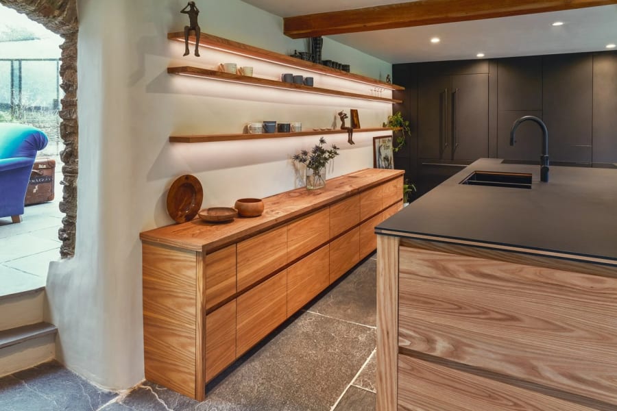 Bespoke kitchen in Torquay with an oak sideboard run and a dark island