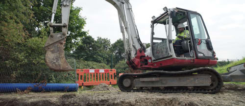 Heffernan Utilities worker operating a digger