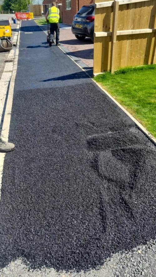reinstatement tarmac pavement men working