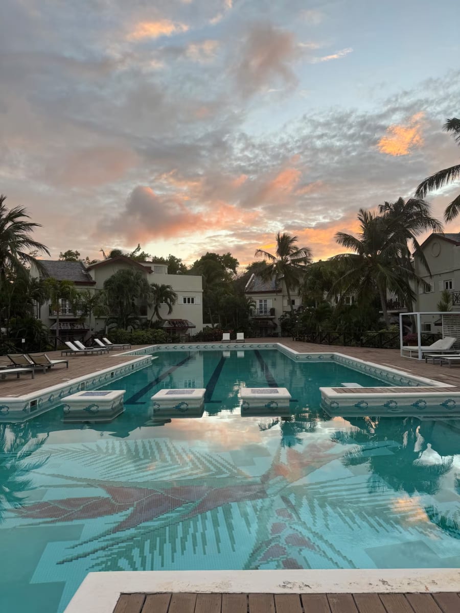 The shared pool at Cap Cove at sunset