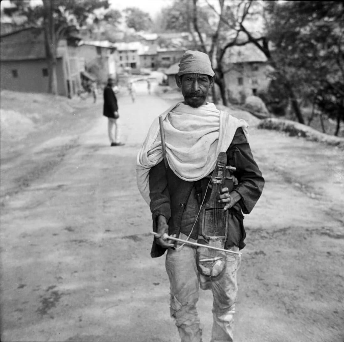 Archival Image of Gaine Singer on the Street of kathmandu 1970s