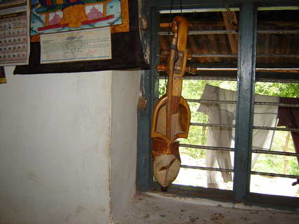 Khim Bahadurs Sarangi in his house window