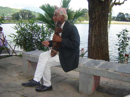 Santa Bahadur Gandharava.48 playing his Sarangi in fron