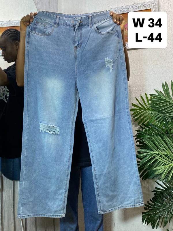 Women's Light Wash Distressed Wide-Leg Denim Jeans.