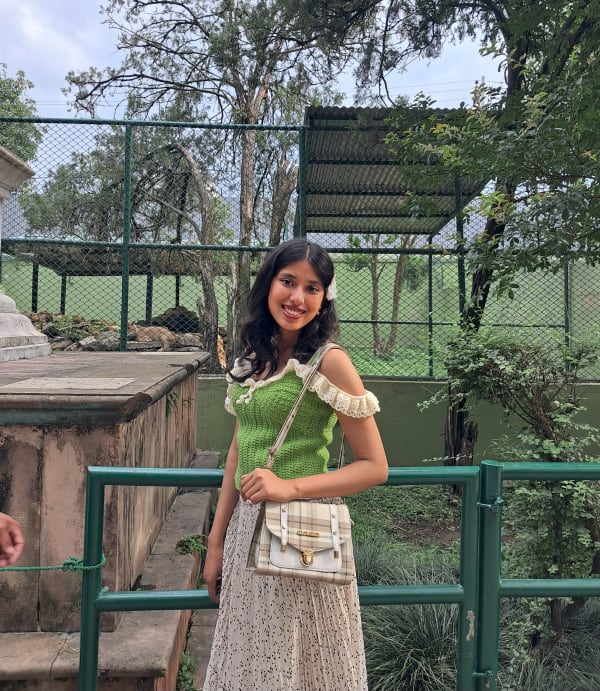 Shikha outdoors, smiling