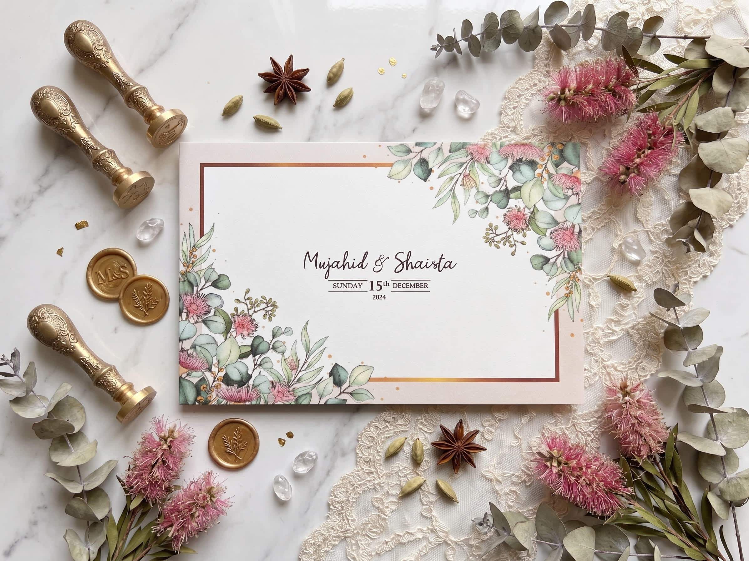 Landscape wedding card with eucalyptus leaves, pink bottlebrush florals and a thin gold frame by Shahi Bulawa Karachi