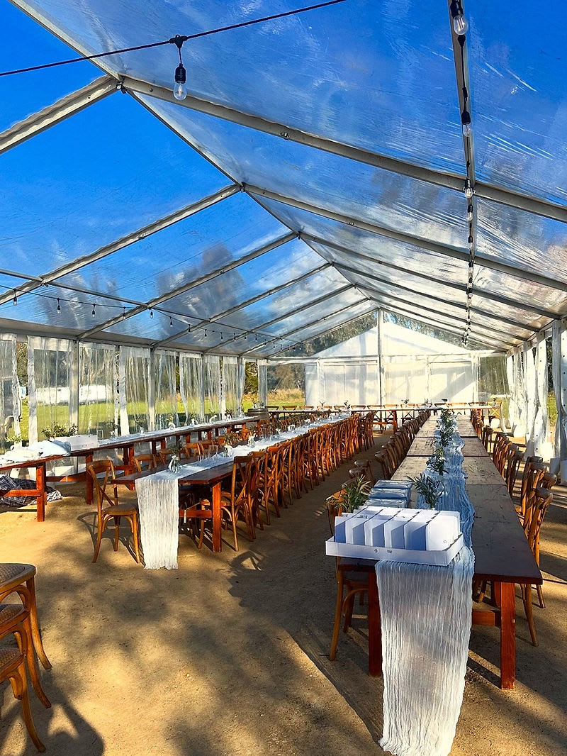 Clearspan marquee hire Brisbane — 8m wide clearspan structure set up for a backyard event