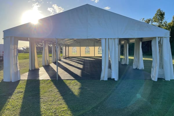 8m x 21m marquee with flooring and festoon lighting Brisbane